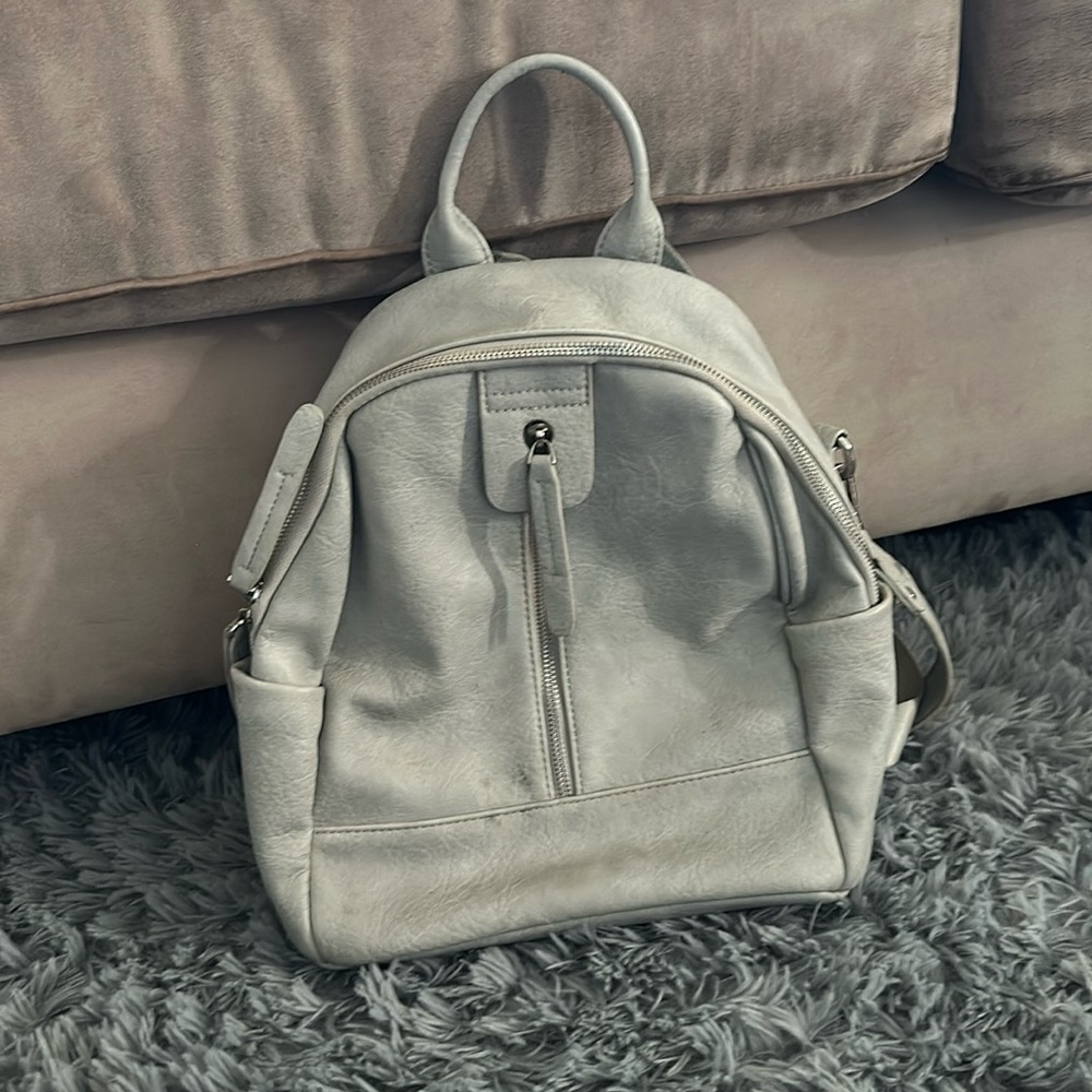 Mode lux backpack it has a small spot on it not sure what it is